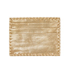 A metallic gold cardholder wallet with a textured finish and decorative braided border, shown flat against a solid white background.