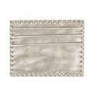 A metallic silver cardholder wallet with a textured leather finish, horizontal card slots, and decorative whipstitching along the edges, shown on a plain white background.