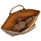 Brown leather tote bag with shoes inside on a white background