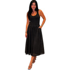 Woman wearing a black sleeveless dress on a white background