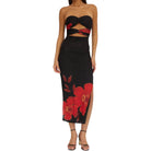 Black strapless dress with red floral design on a white background