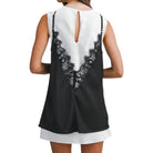 a woman wearing a layered slip dress with lace detail 
