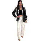 Woman wearing a black and white outfit on a white background