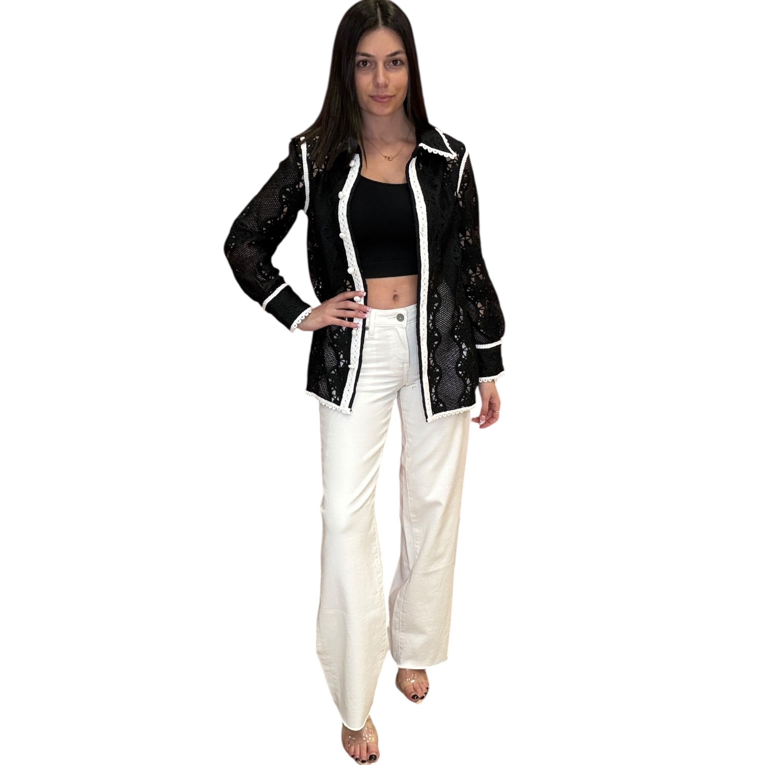 Woman wearing a black and white outfit on a white background