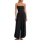 Black strapless jumpsuit worn by a model on a white background