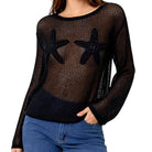 Black mesh top with starfish designs worn by a person on a white background