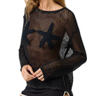 Black mesh sweater with starfish designs on a white background