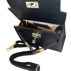 Black handbag with gold accents on a white background