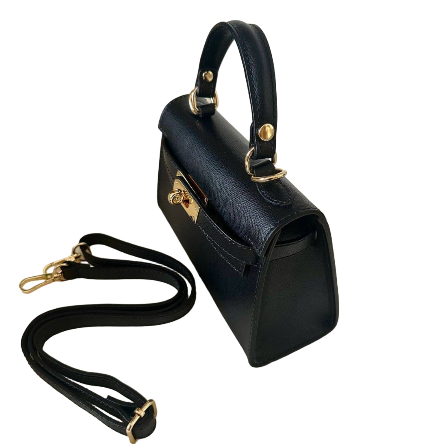 Black handbag with gold accents on a white background