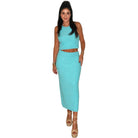Woman wearing a matching turquoise top and skirt set on a white background