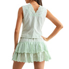 Light green lace set worn by a model on a white background