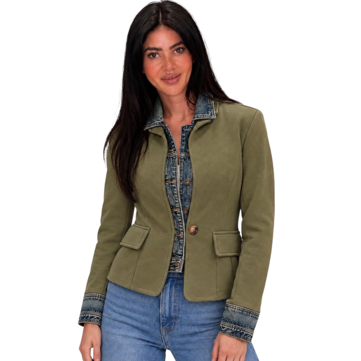 A woman modeling an olive green cropped jacket with a denim collar, button front, and matching denim cuffs, paired with blue jeans against a plain white background.