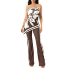 Brown strapless jumpsuit with white abstract design on a white background