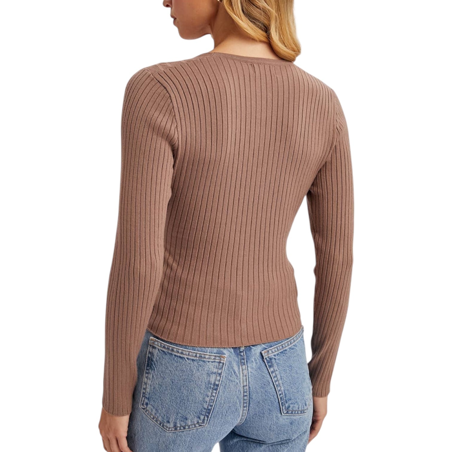 Brown ribbed sweater worn by a person on a white background