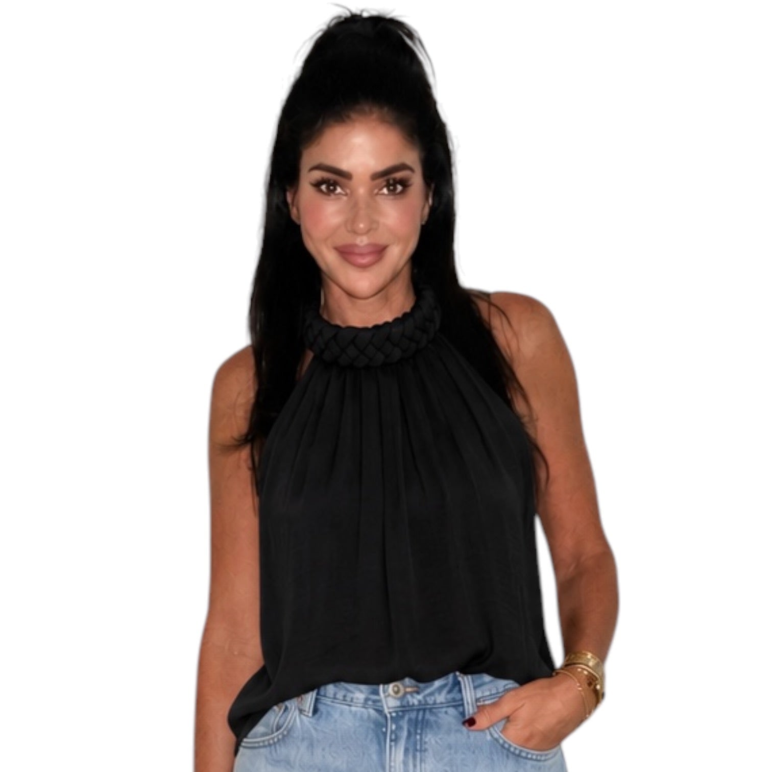 Woman wearing a black sleeveless top with a braided high neckline on a white background