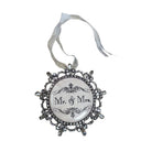 Decorative ornament with 'Mr. & Mrs.' text on a wooden background