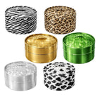 Six round metal containers with lids, arranged on a white background. The top row features two patterned containers: one with a black and white zebra print and one with a tan and brown leopard print.