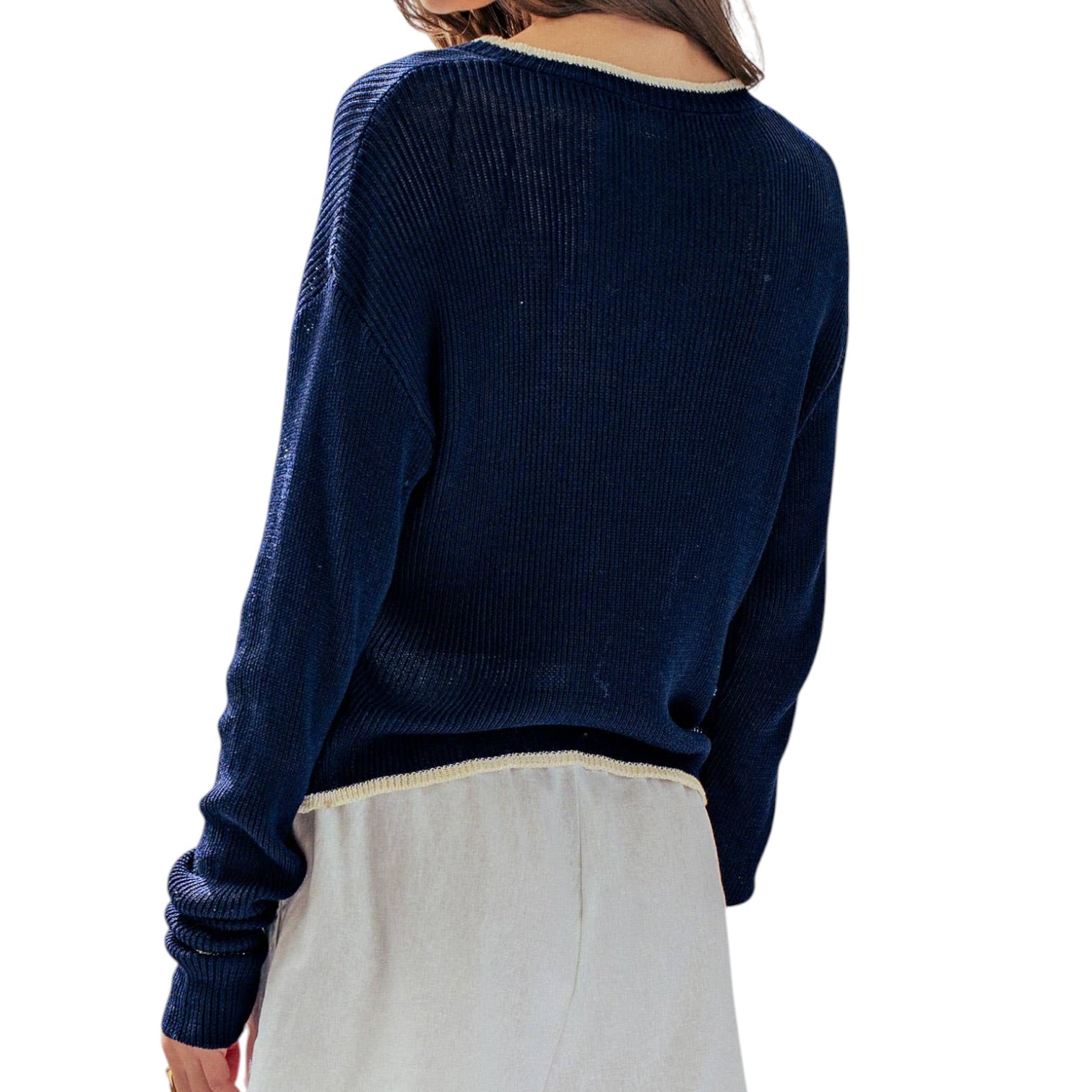 Navy blue sweater worn by a person on a white background
