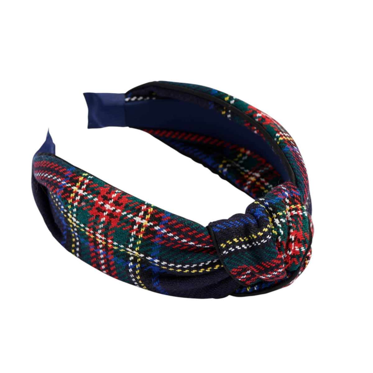 A fabric headband with a knotted front, featuring a multicolor tartan plaid pattern in red, green, blue, yellow, and white over a dark navy base, shown on a plain white background.
