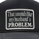 Black cap with a humorous embroidered patch on the back
