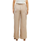 Nude cargo pants worn by a person on a white background