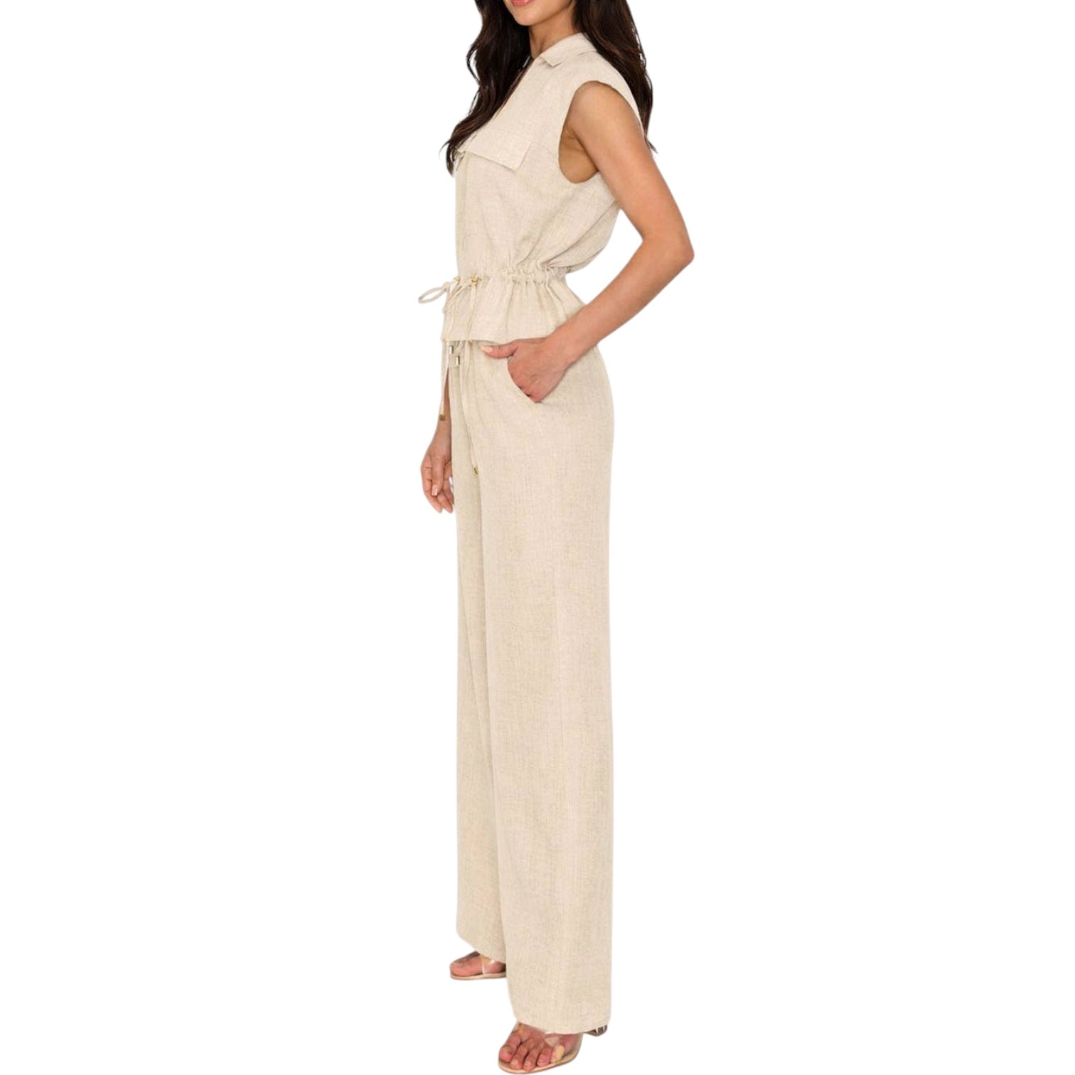 Woman wearing a beige set on a white background