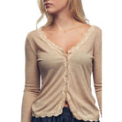 Beige cardigan with lace trim worn by a model on a white background