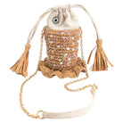 Handbag with sequin embellishments and tassels on a white background