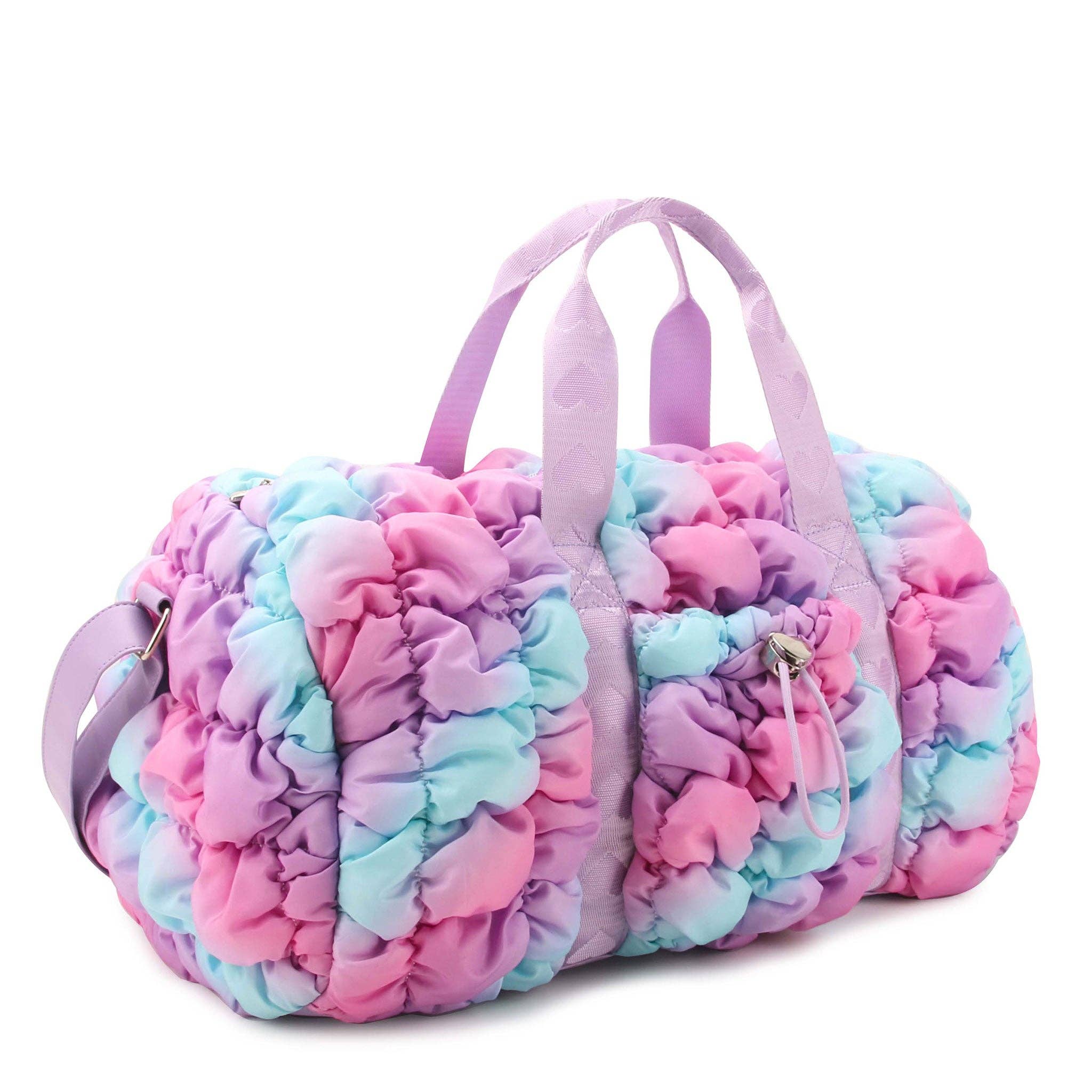 Colorful tie-dye duffel bag with pink handles on a white background