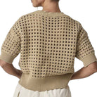 Beige knitted sweater with a textured pattern on a white background