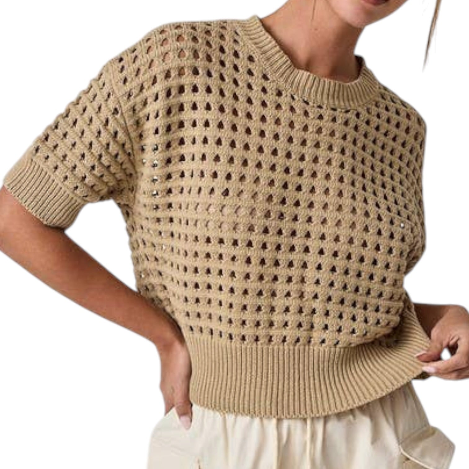 Beige knitted sweater worn by a person on a white background