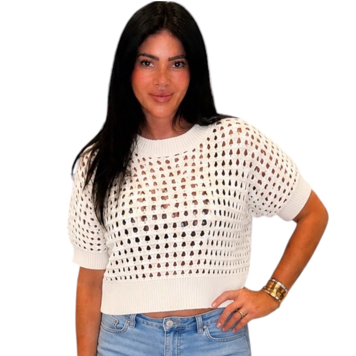 Woman wearing a white open-knit top on a white background