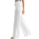 White wide-leg pants worn by a person on a white background