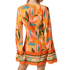 Colorful floral dress with long sleeves on a white background