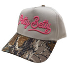 real tree brim trucker hat with "Petty Betty" embroidered in pink