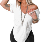 Woman wearing a white off-shoulder top with black pants on a white background