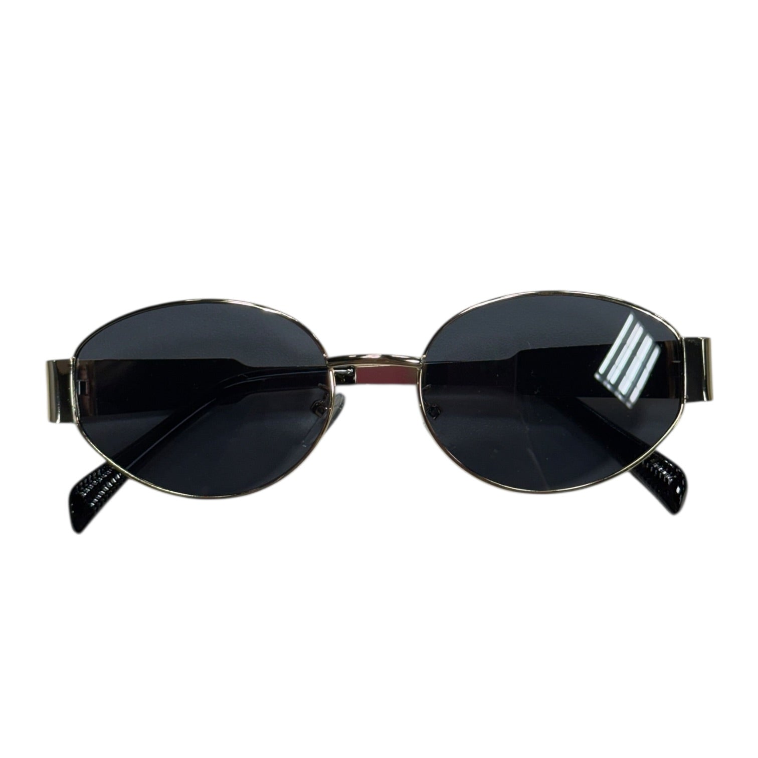 Sunglasses with black lenses and gold frame on a white background