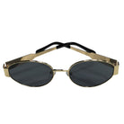 Gold-framed sunglasses with black lenses on a white background