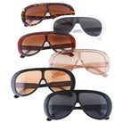 Collection of various sunglasses with different lens colors and frame designs on a white background.