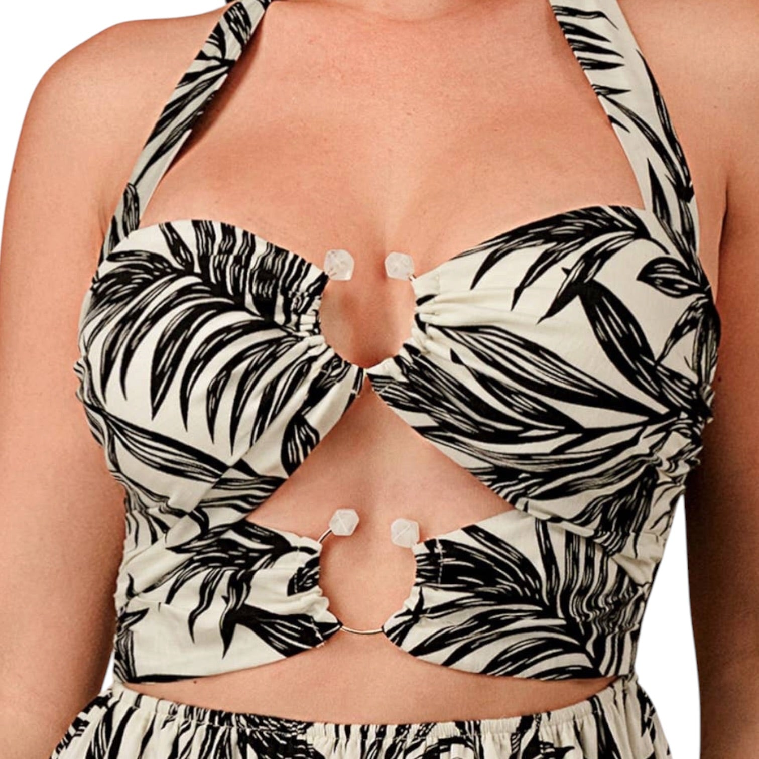 Black and white leaf-patterned halter top on a person