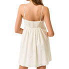 White dress with thin straps on a white background