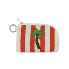Beaded pouch with red and white stripes and a palm tree design on a beige background