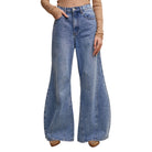 Blue wide-leg jeans worn by a person on a white background