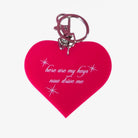 Heart-shaped keychain with text on a white background