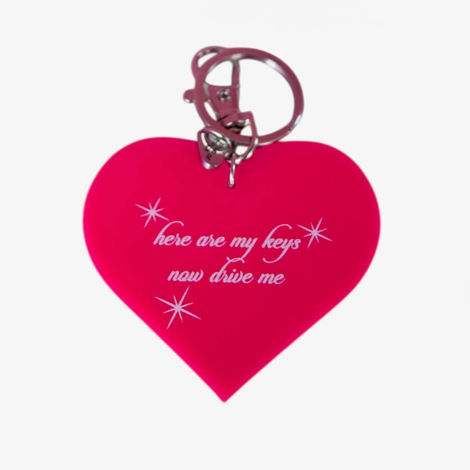 Heart-shaped keychain with text on a white background