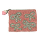 Pink beaded pouch with bow designs and a pom-pom on a white background