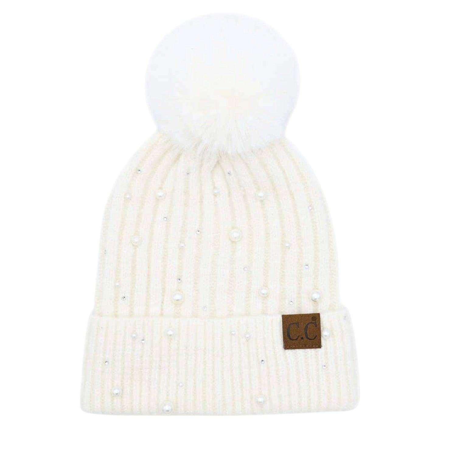 An off-white ribbed knit pom-pom beanie decorated with small pearl-like beads and featuring a brown leather patch with 'CC' on the cuff, shown against a plain white background.