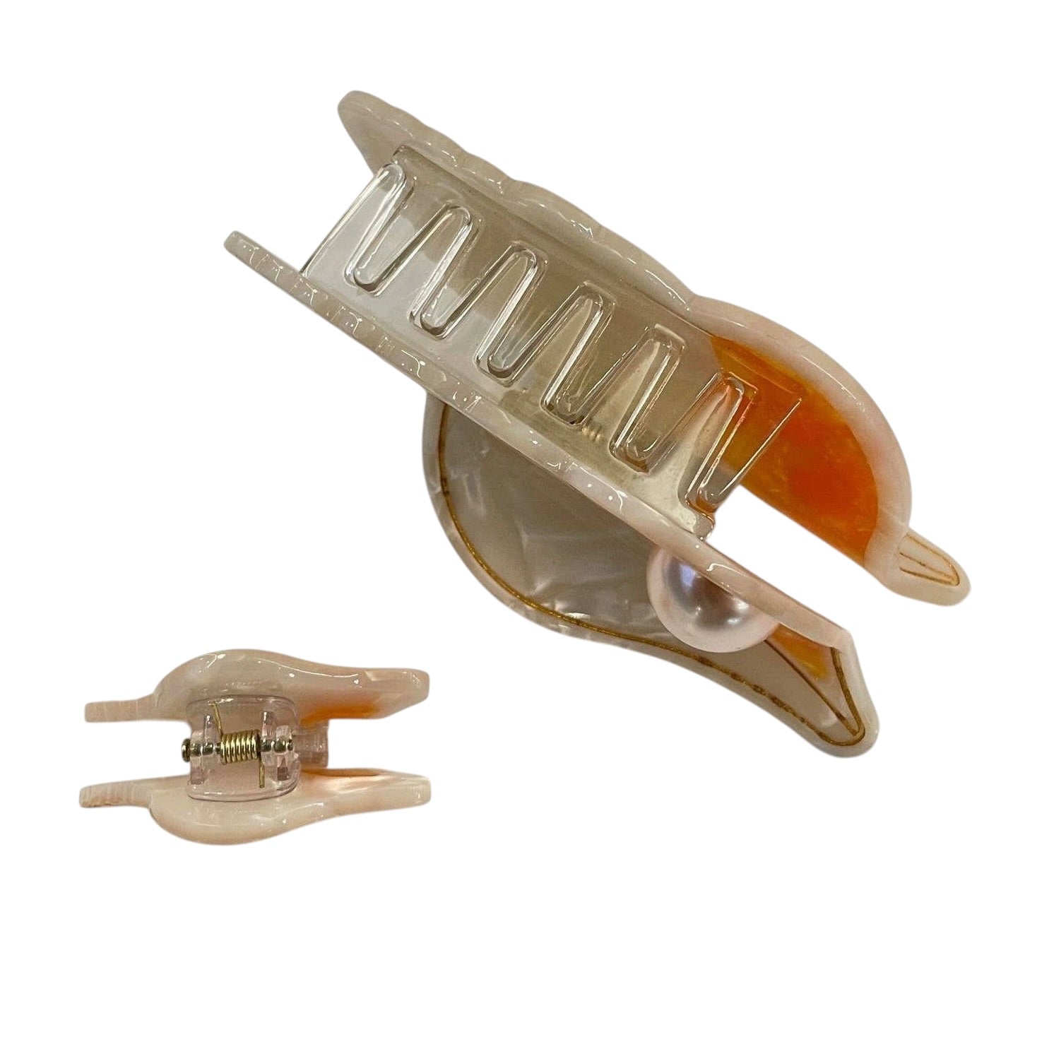 Beige hair clip with comb on a white background