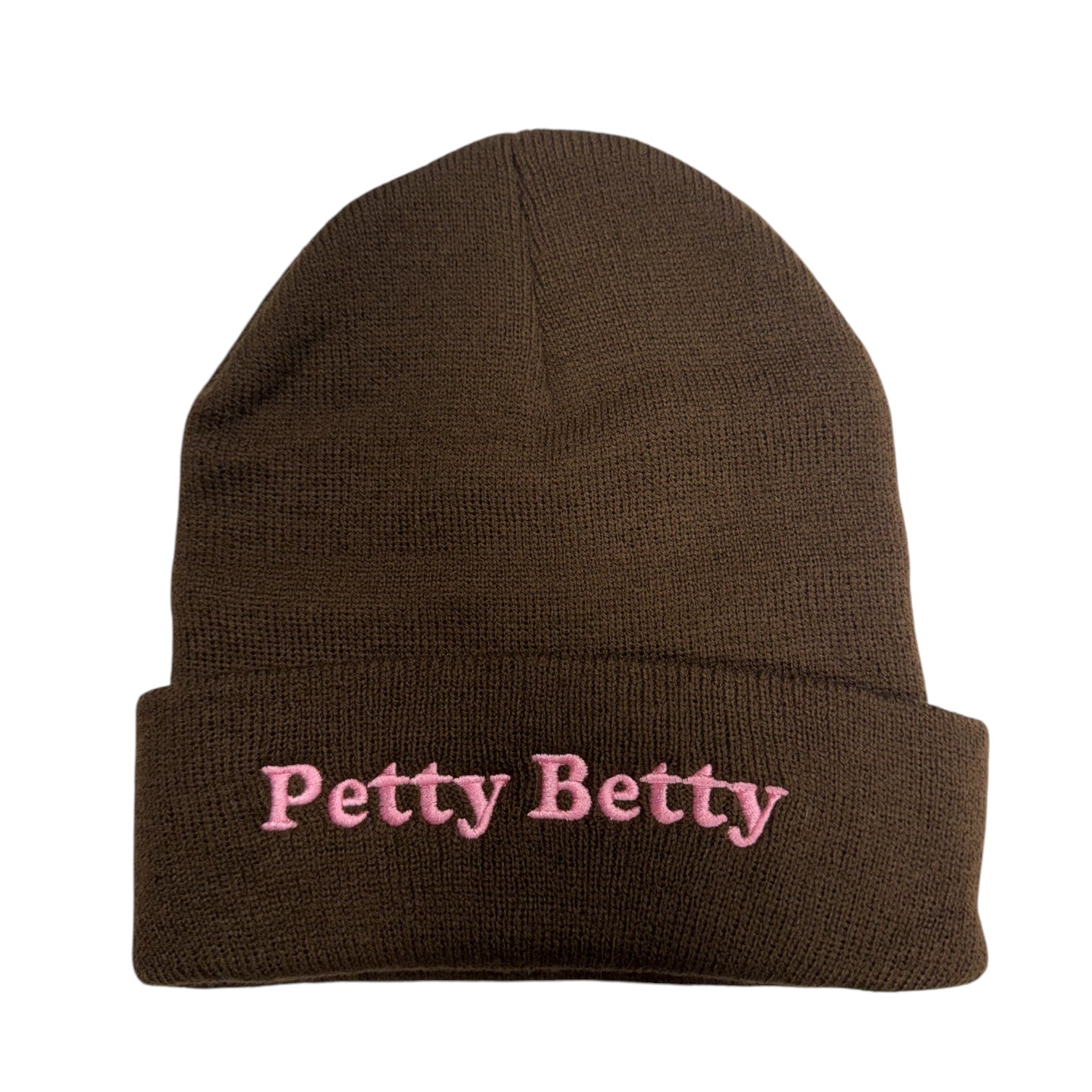 A dark brown knit beanie hat with a folded cuff, featuring the text 'Petty Betty' embroidered in pink on the front, set against a plain white background.