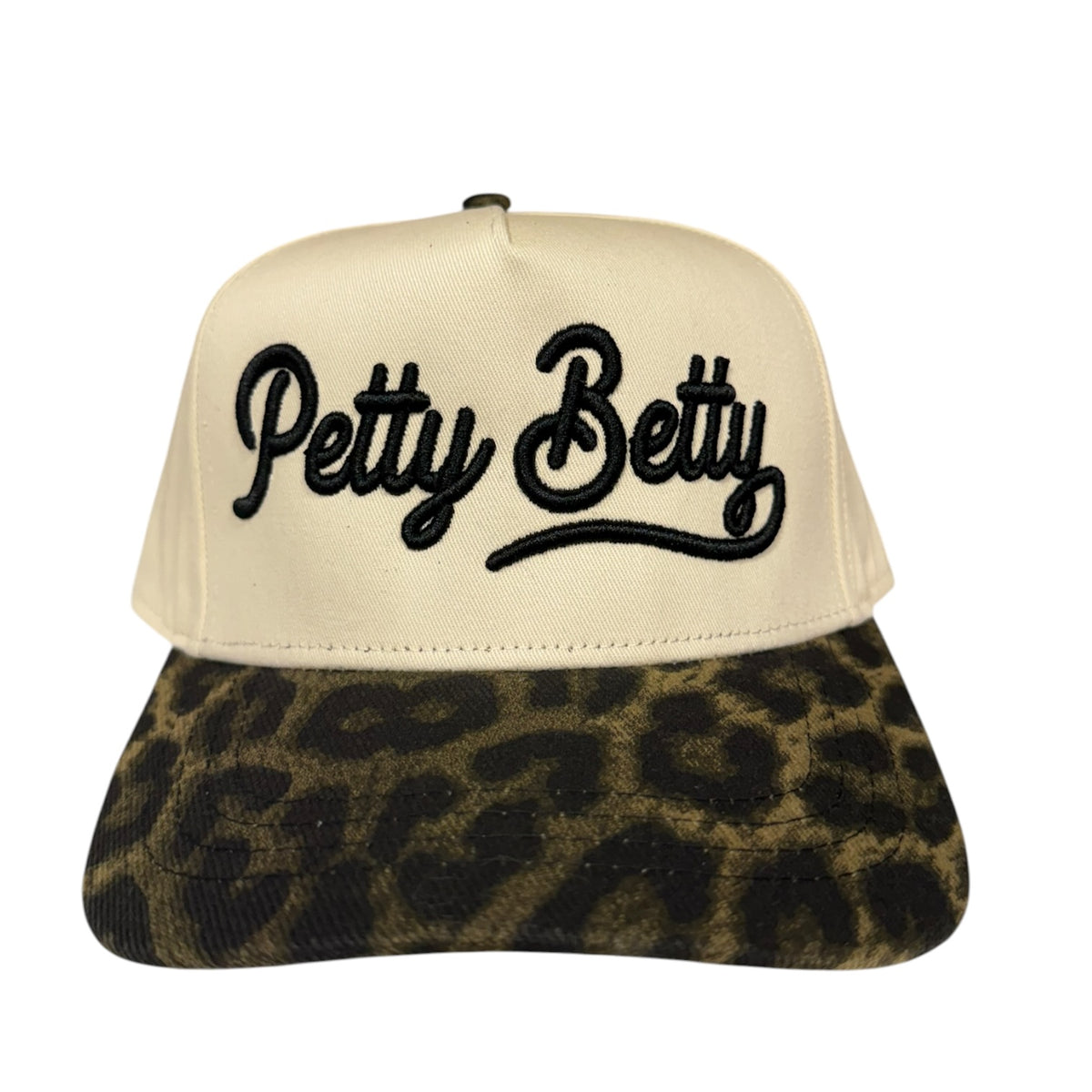 A snapback cap with a cream-colored front panel and black embroidered 'Petty Betty' script, paired with a dark brown and black leopard-print brim.